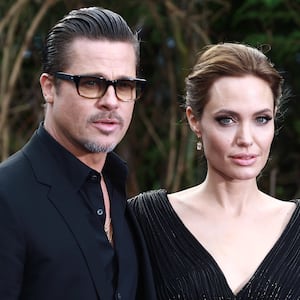 Brad Pitt and Angelina Jolie attend a private reception as costumes and props from Disney's "Maleficent" are exhibited in support of Great Ormond Street Hospital at Kensington Palace on May 8, 2014 in London, England.