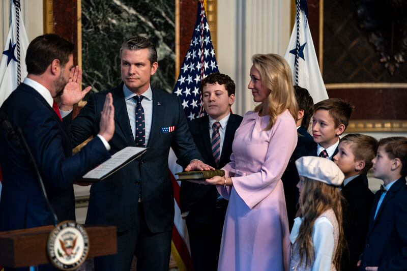 WASHINGTON, DC - JANUARY 25: U.S. Vice President J.D. Vance (L) swears in Secretary of Defense Pete Hegseth alongside his wife Jennifer Rauchet and their children in the Indian Treaty Room in the Eisenhower Executive Office Building on January 25, 2025 in Washington, DC. The Senate confirmed Pete Hegseth as Defense Secretary in a 51-50 vote, with Vice President J.D. Vance breaking the tie after three Republicans joined Democrats in opposition. It's only the second time in history that a vice president has broken a tie for a cabinet nominee. The first was Betsy DeVos in 2017. (Photo by Kent Nishimura/Getty Images)