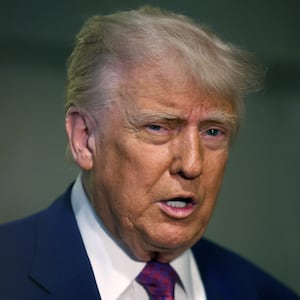 President Donald Trump arrives for a House Republican meeting at the U.S. Capitol.