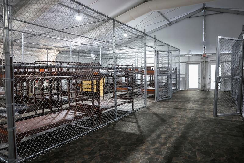 Each tent at Alligator Alcatraz has eight large cages, which hold 35 to 38 inmates. An ex-guard said that water “pours” into the tents during storms.