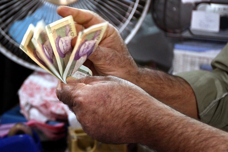articles/2012/10/04/iran-s-currency-crisis-bad-news-for-mahmoud-ahmadinejad/iran-money-rial-memarian-tease_kc4cwv