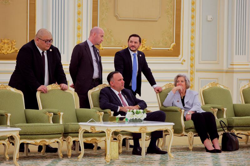 White House Communications Director Stephen Cheung (far left) is pictured with a group of Trump staffers during a ceremony at the Royal Court in Riyadh, Saudi Arabia, May 13, 2025.