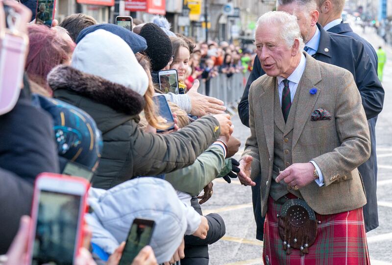 King Charles III meets the crowds on Union Street during a visit to Aberdeen Town House to meet families who have settled in Aberdeen from Afghanistan, Syria and Ukraine, in Aberdeen, Scotland, Britain October 17, 2022.
