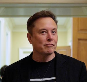 WASHINGTON, DC - MARCH 05: White House Senior Advisor to the President, Tesla and SpaceX CEO Elon Musk (C) is accompanied by Katie Miller (L) as he leaves a meeting with Senate Republicans in the U.S. Captiol on March 05, 2025 in Washington, DC. Senators said Musk talked behind closed doors about his work with the Department of Government Efficiency (DOGE). (Photo by Chip Somodevilla/Getty Images)