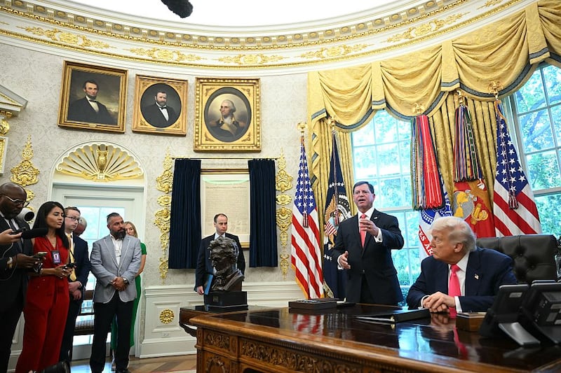 Commissioner of the Social Security Administration Frank Bisignano (2nd-R) speaks as US President Donald Trump looks on prior to signing a presidential proclamation honoring the 90th anniversary of the Social Security Act in the Oval Office of the White House in Washington, DC on August 14, 2025. (Photo by Mandel NGAN / AFP) (Photo by MANDEL NGAN/AFP via Getty Images)