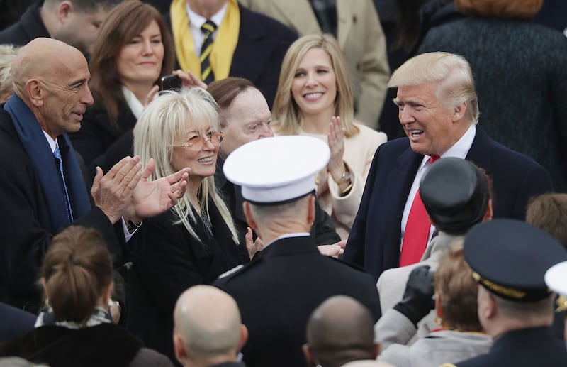 Tom Barrack, Miriam Adelson and Sheldon Adelson greet U.S. President-elect Donald Trump on the West Front of the U.S. Capitol on January 20, 2017 in Washington, DC. In today's inauguration ceremony Donald J. Trump becomes the 45th president of the United States.  (Photo by Chip Somodevilla/Getty Images)