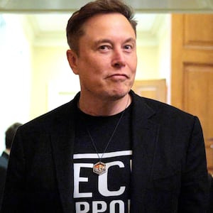 Elon Musk accompanied by DOGE adviser Katie Miller (left) leave a meeting with Senate Republicans on March 05, 2025.