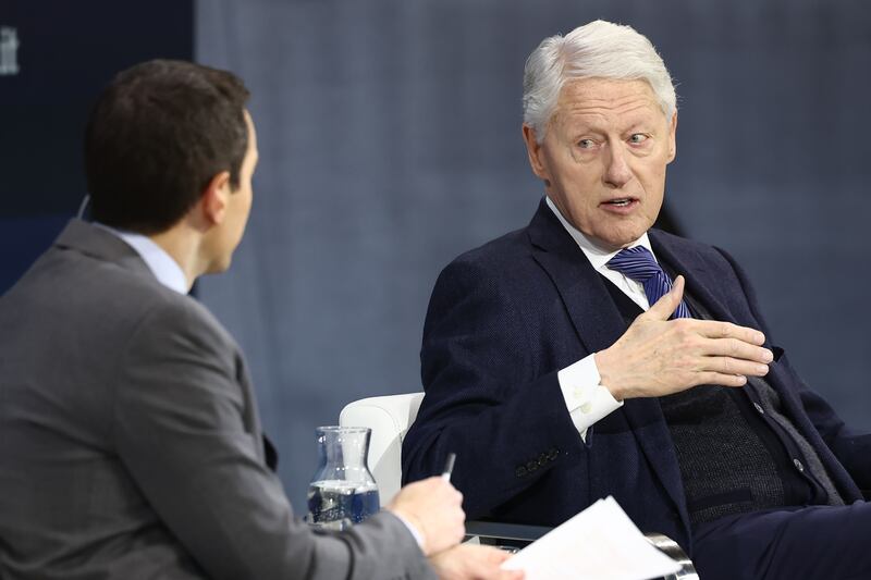 NEW YORK, NEW YORK - DECEMBER 04: New York Times columnist Andrew Ross Sorkin and former U.S. President Bill Clinton speak during the New York Times annual DealBook summit at Jazz at Lincoln Center on December 04, 2024 in New York City. The NYT summit with Ross Sorkin returns with interviews on the main stage including Sam Altman, co-founder and C.E.O. of OpenAI, Jeff Bezos, founder and executive chairman of Amazon and owner of the Washington Post, and Prince Harry, The Duke of Sussex, among others. The discussions will touch on topics such as business, politics and culture. (Photo by Michael M. Santiago/Getty Images)