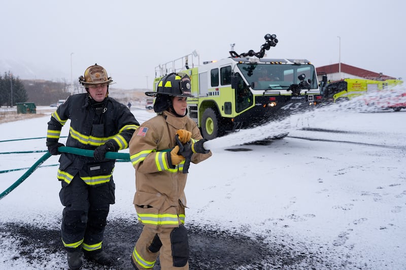 Kristi Noem participates in a firefighting drill