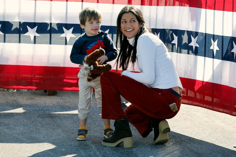 Katie Miller and her son at a Donald Trump campaign rally last year. She married the top Trump adviser Stephen Miller in 2020 with the president in attendance.