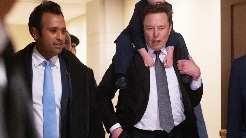 Vivek Ramaswamy and Elon Musk, with his son X, depart the Capitol building in Washington, DC on December 05, 2024.
