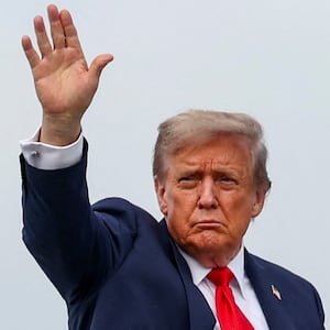 U.S. President Donald Trump waves as he boards Air Force One at Joint Base Elmendorf-Richardson, Alaska.