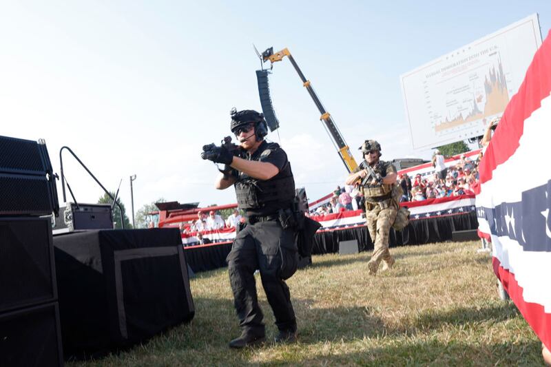 BUTLER, PENNSYLVANIA - JULY 13: Law enforcement officers move during a rally on July 13, 2024 in Butler, Pennsylvania. Butler County district attorney Richard Goldinger said the shooter is dead after injuring former U.S. President Donald Trump, killing one audience member and injuring another in the shooting. (Photo by Anna Moneymaker/Getty Images)