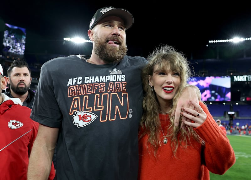 Travis Kelce #87 of the Kansas City Chiefs celebrates with Taylor Swift after a 17-10 victory against the Baltimore Ravens in the AFC Championship Game at M&T Bank Stadium on January 28, 2024 in Baltimore, Maryland.