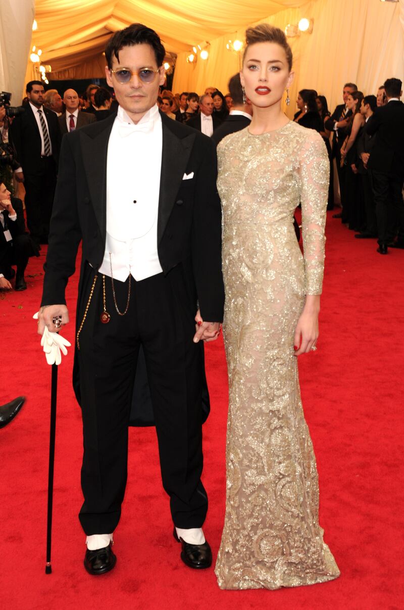 Johnny Depp and Amber Heard attend the "Charles James: Beyond Fashion" Costume Institute Gala at the Metropolitan Museum of Art on May 5, 2014 in New York.