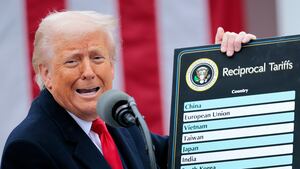 WASHINGTON, DC - APRIL 02: U.S. President Donald Trump holds up a chart while speaking during a “Make America Wealthy Again” trade announcement event in the Rose Garden at the White House on April 2, 2025 in Washington, DC. Touting the event as “Liberation Day”, Trump is expected to announce additional tariffs targeting goods imported to the U.S. (Photo by Chip Somodevilla/Getty Images)