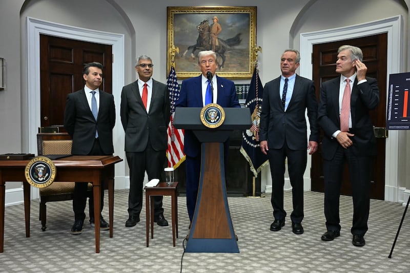 President Donald Trump (C), alongside (L-R) FDA Commissioner Marty Makary,  National Institute of Health (NIH) Director Jayanta Bhattacharya, Secretary of Health and Human Services Robert F. Kennedy Jr and Administrator for the Centers for Medicare and Medicaid Services Mehmet Oz, speaks during a news conference about prescription drug prices, in the Roosevelt Room of the White House on May 12, 2025, in Washington, DC.