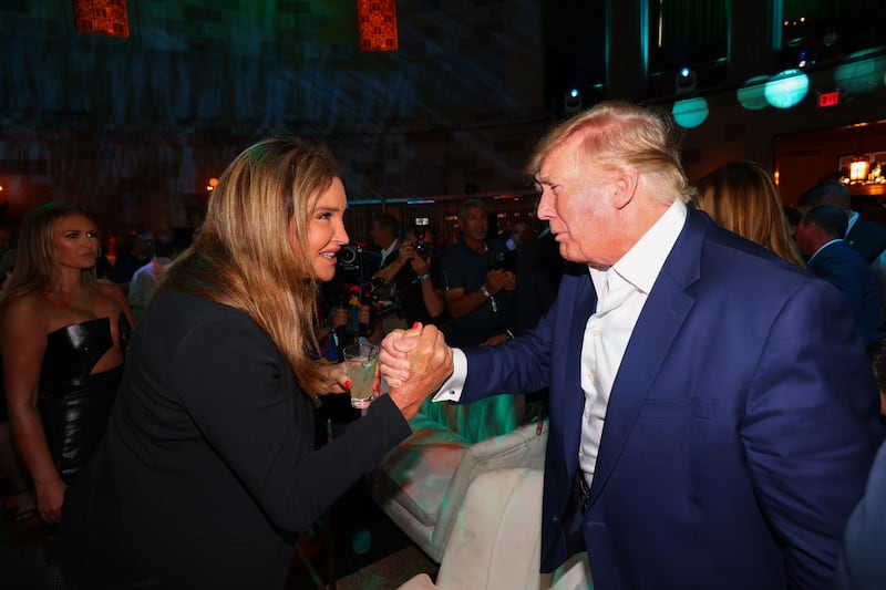 Caitlyn Jenner (L) shaking hands with Donald Trump (R)