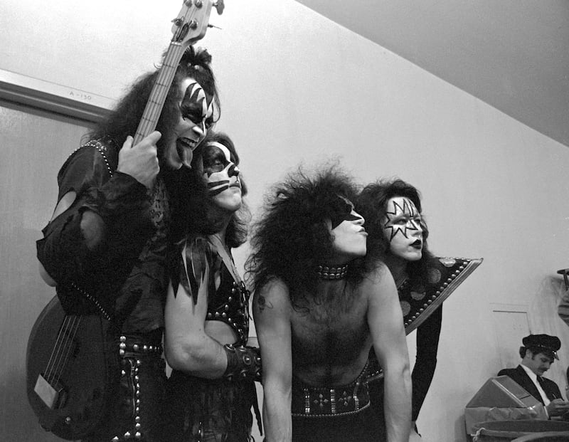 KISS musicians Gene Simmons, Peter Criss, Paul Stanley and Ace Frehley pose in their dressing room before performing at The Forum in Inglewood, California circa 1976.