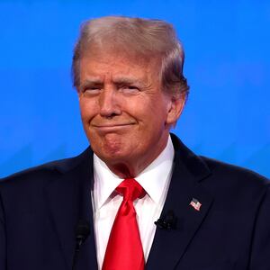 Republican presidential candidate, former U.S. President Donald Trump reacts during the CNN Presidential Debate at the CNN Studios