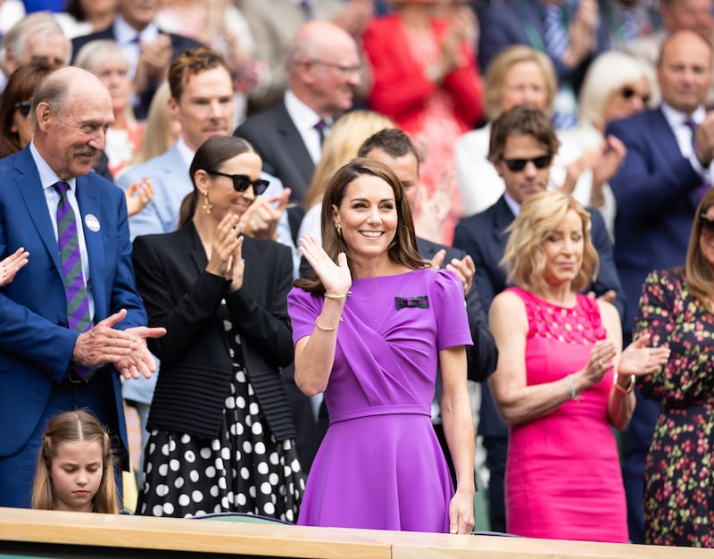 Catherine, Princess of Wales waves to the crowd from the Royal Box before the start of the Mens Singles Final at The Wimbledon Lawn Tennis Championship at the All England Lawn and Tennis Club at Wimbledon on July 14th, 2024 in London, England.