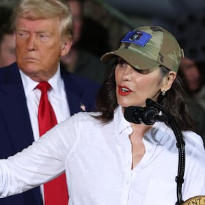 President Donald Trump listens as Michigan Gov. Gretchen Whitmer speaks during a visit with Michigan Air National Guard Troops on April 29, 2025 at Selfridge Air National Guard Base.