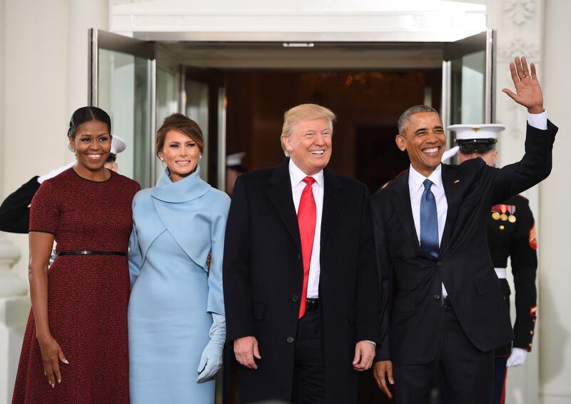 US President Barack Obama(R) and First Lady Michelle Obama(L) welcome President-elect Donald Trump(2nd-R) and his wife Melania to the White House in Washington, DC January 20, 2017.