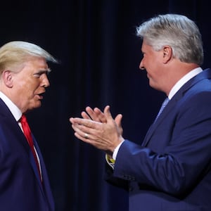U.S. President Donald Trump is greeted by Pastor Robert Morris in 2020. 
