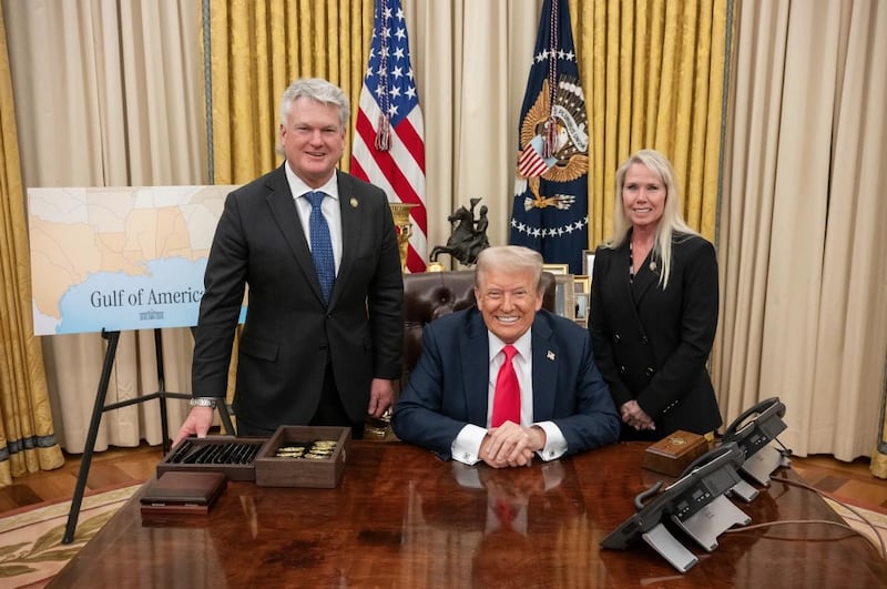 Rep. Mike Collins standing behind President Donald Trump as seen in an image on his campaign website after the  MAGA lawmaker launched a Senate bid in Georgia.