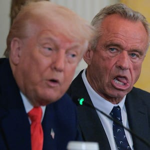 WASHINGTON, DC - MAY 22: U.S. President Donald Trump and Health and Human Services Secretary Robert F. Kennedy Jr. attend an event introducing a new Make America Healthy Again Commission report in the East Room of the White House on May 22, 2025 in Washington, DC. The commission, which is tasked with studying the potential causes for the "childhood chronic disease crisis," recommends reassessing the nation’s childhood vaccine schedule, scrutinizing ultra-processed foods and studying pesticides used in commercial farming. The Trump administration has proposed a FY2026 budget of $94 billion for the Department of Health and Human Services -- a reduction of about 26-percent from the 2025 level -- cutting programs and staff at the National Institutes of Health and the Centers for Disease Control and Prevention. (Photo by Chip Somodevilla/Getty Images)