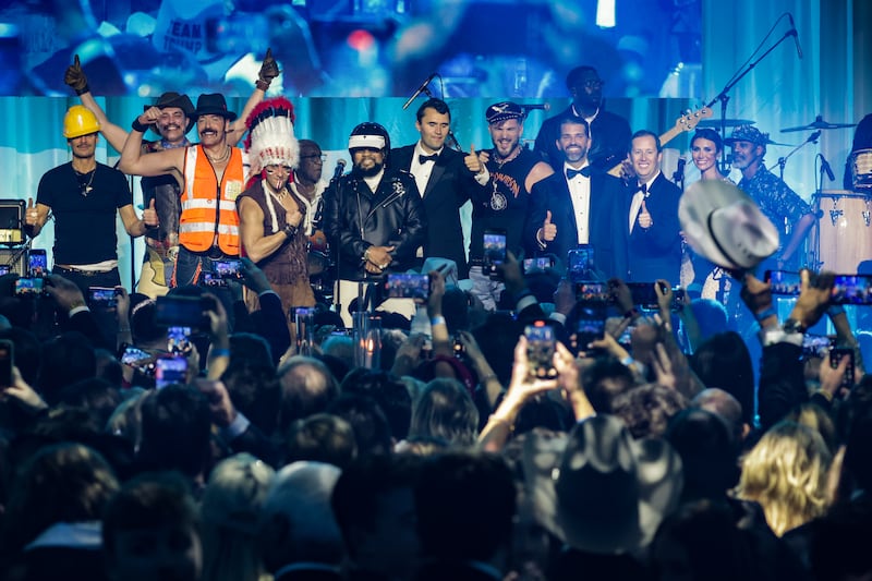 WASHINGTON, DC - JANUARY 19: Alina Habba, Senior Advisor to President Donald J. Trump, (second right), Sergio Gor (third right), Donald Trump Jr. (4th right), Charlie Kirk (center), and Kid Rock (left) on stage with The Village People during the Turning Point USA Inaugural-Eve Ball at the Salamander Hotel on January 19, 2025 in Washington, DC. (Photo by Samuel Corum/Getty Images)