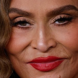 Tina Knowles smirks.