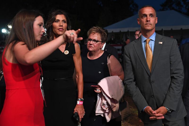 South Dakota Governor Kristi Noem (2-L) and former Donald Trump 2016 campaign manager Corey Lewandowski (R) attend US President Donald Trump's acceptance speech for the Republican Party nomination for reelection during the final day of the Republican National Convention at the South Lawn of the White House in Washington, DC on August 27, 2020. (Photo by SAUL LOEB / AFP) (Photo by SAUL LOEB/AFP via Getty Images)