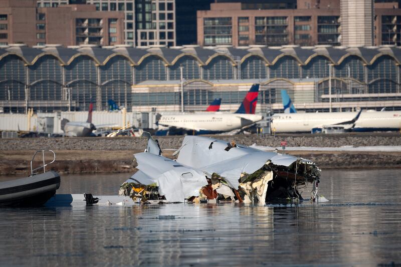 In this U.S. Coast Guard handout, the Coast Guard investigates aircraft wreckage on the Potomac River on January 30, 2025 in Washington, DC. An American Airlines flight from Wichita, Kansas collided midair with a military Black Hawk helicopter while on approach to Ronald Reagan Washington National Airport outside of Washington, DC. According to reports, there were no survivors among the 67 people onboard both aircraft.