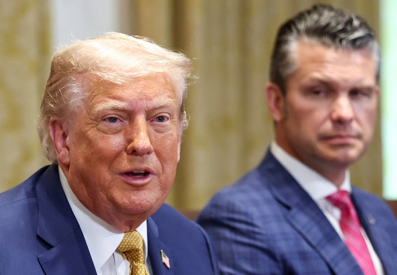 U.S. President Donald Trump speaks next to Defense Secretary Pete Hegseth during a cabinet meeting at the White House in Washington, D.C., U.S., July 8, 2025.   REUTERS/Kevin Lamarque