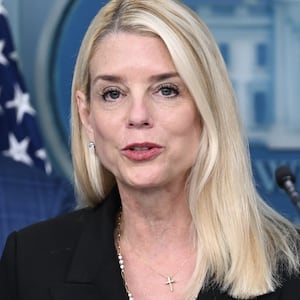 Pam Bondi during a press conference and FBI agenst speakign to a man on the street on D.C.