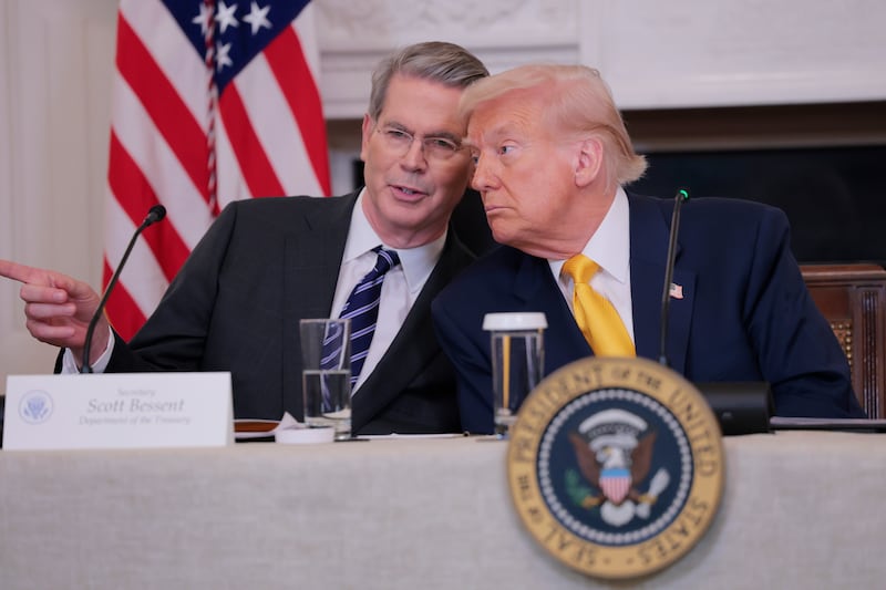 U.S. Secretary of Treasury Scott Bessent and U.S. President Donald Trump look on during The White House Digital Assets Summit in the State Dining Room of the White House on March 07, 2025 in Washington, DC.