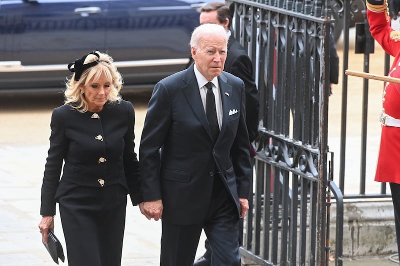 US President Joe Biden and first lady Jill Biden arrive to take their seats inside Westminster Abbey in London on September 19, 2022, for the State Funeral Service for Britain's Queen Elizabeth II.