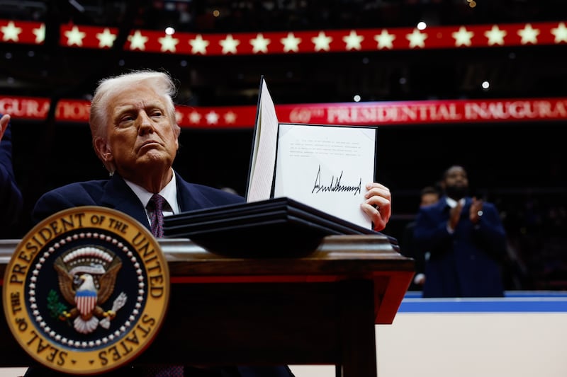 Donald Trump with a signed executive order