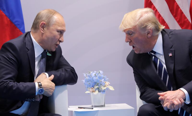U.S. President Donald Trump speaks with Russian President Vladimir Putin during the their bilateral meeting at the G20 summit in Hamburg, Germany July 7, 2017. REUTERS/Carlos Barria     TPX IMAGES OF THE DAY