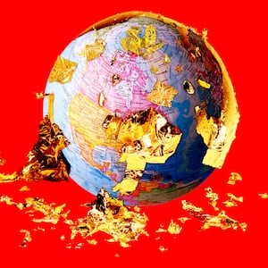 A photo illustration of Planet Earth covered in flaking gold foil.