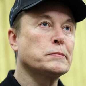 FILE PHOTO: Elon Musk looks on, in the Oval Office of the White House in Washington, D.C., U.S., February 11, 2025. REUTERS/Kevin Lamarque/File Photo