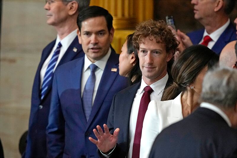 CEO of Meta, Mark Zuckerberg (C) attends President Donald Trump's inauguration ceremony in the US Capitol Rotunda in Washington, DC, on January 20, 2025.