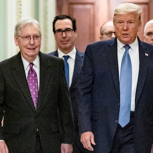 WASHINGTON, DC - MARCH 10: U.S. President Donald Trump arrives at the US Capitol to attend the Republicans weekly policy luncheon on March 10, 2020 in Washington, DC. He is flanked by (L-R) Senate Majority Leader Mitch McConnell (R-KY), Treasury Secretary Steve Mnuchin, Vice President Mike Pence and Republican Policy Committee Chairman Senator Roy Blunt (R-MO).(Photo by Samuel Corum/Getty Images)