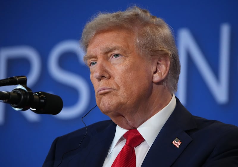 U.S. President Donald Trump delivers a statement during a press conference with Russian President Vladimir Putin in Alaska