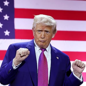 U.S. President Donald J. Trump gestures on stage.