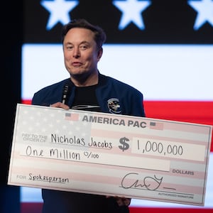 GREEN BAY, WISCONSIN - MARCH 30: Billionaire businessman Elon Musk prepares to give $1,000,000 to a Wisconsin voter during a town hall meeting he was hosting at the KI Convention Center on March 30, 2025 in Green Bay, Wisconsin. The town hall is being held in front of the state’s high-profile Supreme Court election between Circuit Court Judge Brad Schimel, who has been financially backed by Musk and endorsed by President Donald Trump, and Dane County Circuit Court Judge Susan Crawford. (Photo by Scott Olson/Getty Images)