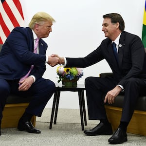 Former Brazilian President Jair Bolsonaro meets with US President-elect Donald Trump during a bilateral meeting on the sidelines of the G20 Summit in Osaka on June 28, 2019.