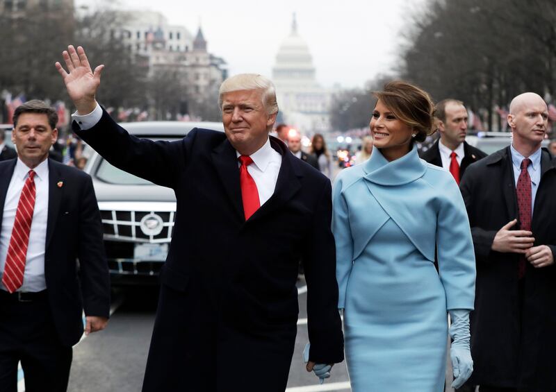 Donald Trump and Melania Trump walk during the inaugural parade from the U.S. Capitol in 2017.