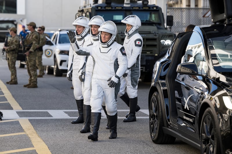 In this NASA handout, NASA astronauts Anne McClain and Nichole Ayers, JAXA (Japan Aerospace Exploration Agency) astronaut Takuya Onishi, and Roscosmos cosmonaut Kirill Peskov, wearing SpaceX spacesuits, are seen as they prepare to depart the Neil  A. Armstrong Operations and Checkout Building for Launch Complex 39A on NASA's Kennedy Space Center to board the SpaceX Dragon spacecraft for the Crew-10 mission launch, Wednesday, March 12, 2025, at NASA's Kennedy Space Center in Florida.